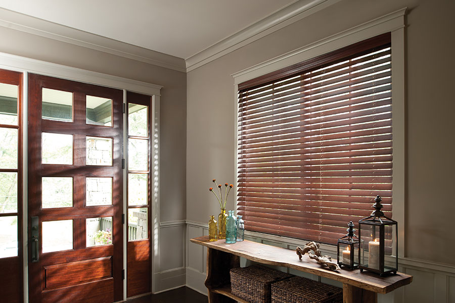 Dark wood blinds in the front entryway